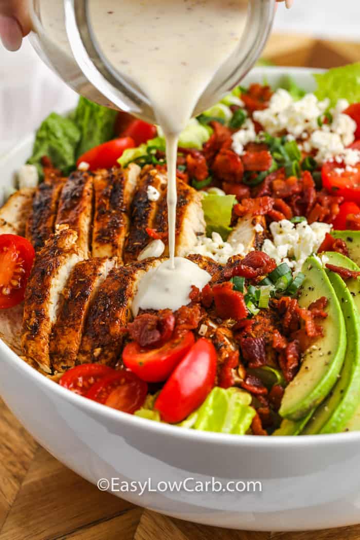 pouring dressing in BLT Chicken Salad