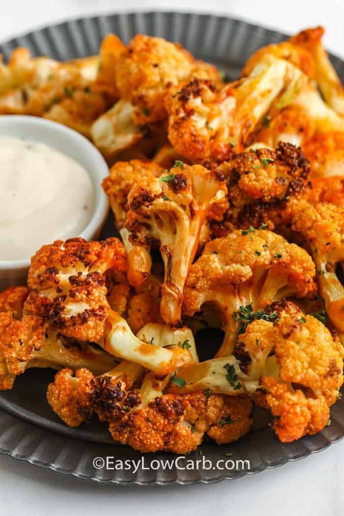 Buffalo Cauliflower Air Fryer Recipe on a plate with dip