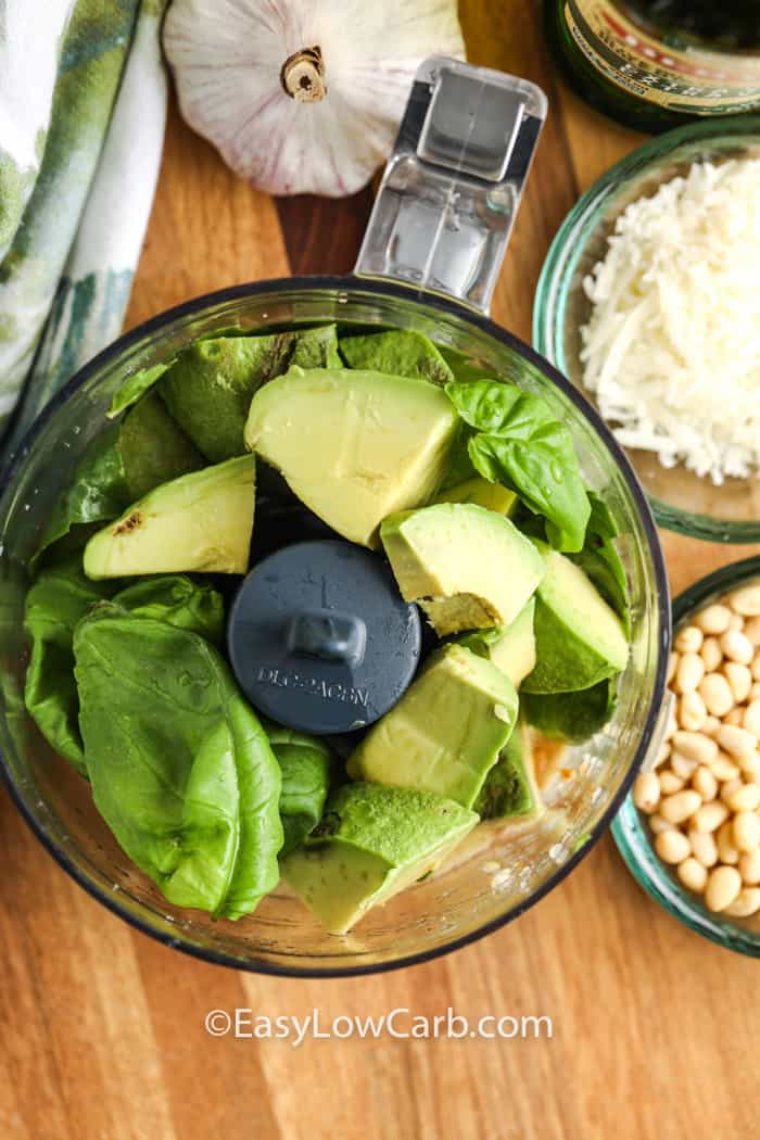 ingredients for avocado pesto in a food processor