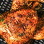 Air Fryer Roast Chicken cooked in the air fryer with writing