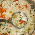 Chicken Cauliflower Rice Soup in the pot with a paddle