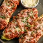 three zucchini lasagna boats on plate