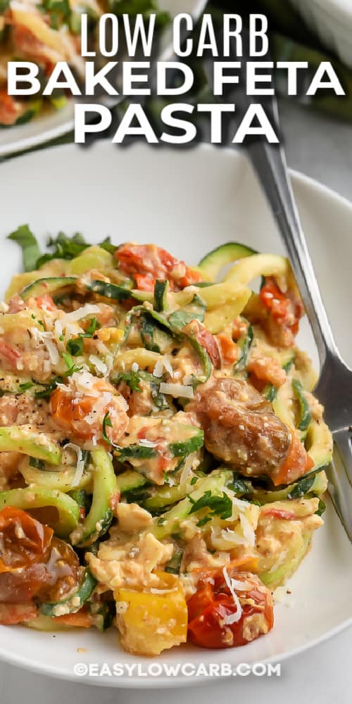 close up of feta zucchini pasta in a white bowl with text