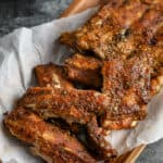 cooked ribs on a wood dish