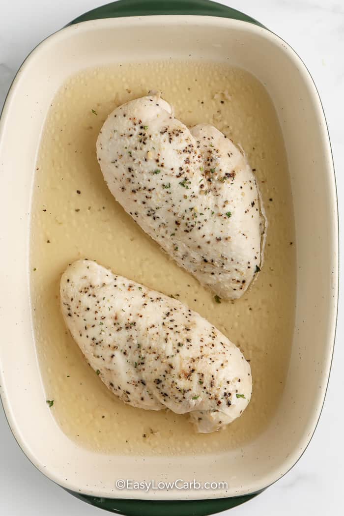 cooked chicken breasts for shredded chicken in a casserole dish