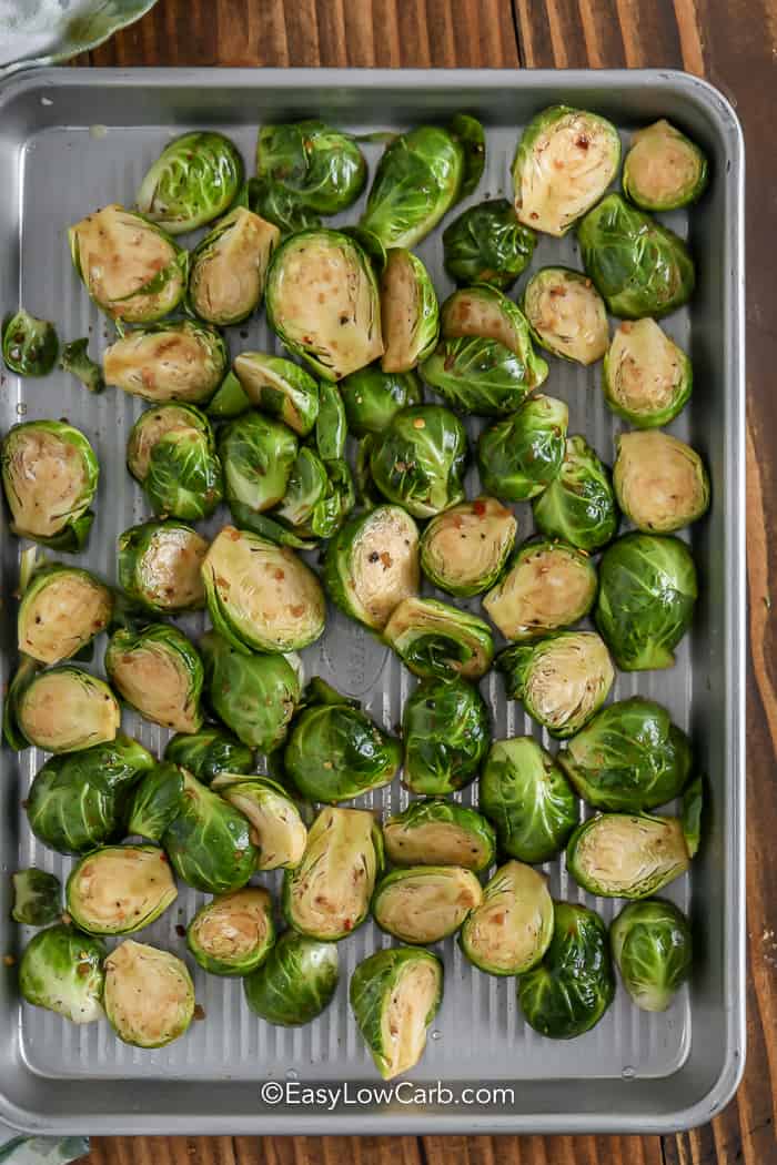 Brussels Sprouts on a sheet pan before being roasted