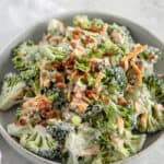 broccoli bacon cheese salad in a grey bowl