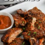 Crock Pot BBQ Ribs on a serving tray with sauce with text