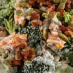 close up of broccoli bacon cheese salad with text