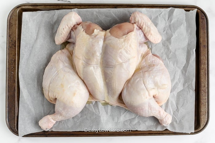 uncooked Butterflied Chicken on a pan