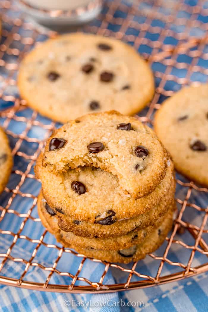 pile of Keto Chocolate Chip Cookies with bite taken out of one