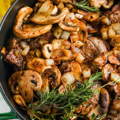 cooking Braised Steak and Mushrooms in a pan