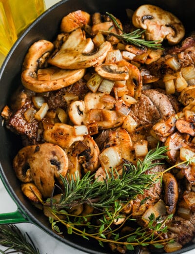 cooking Braised Steak and Mushrooms in a pan