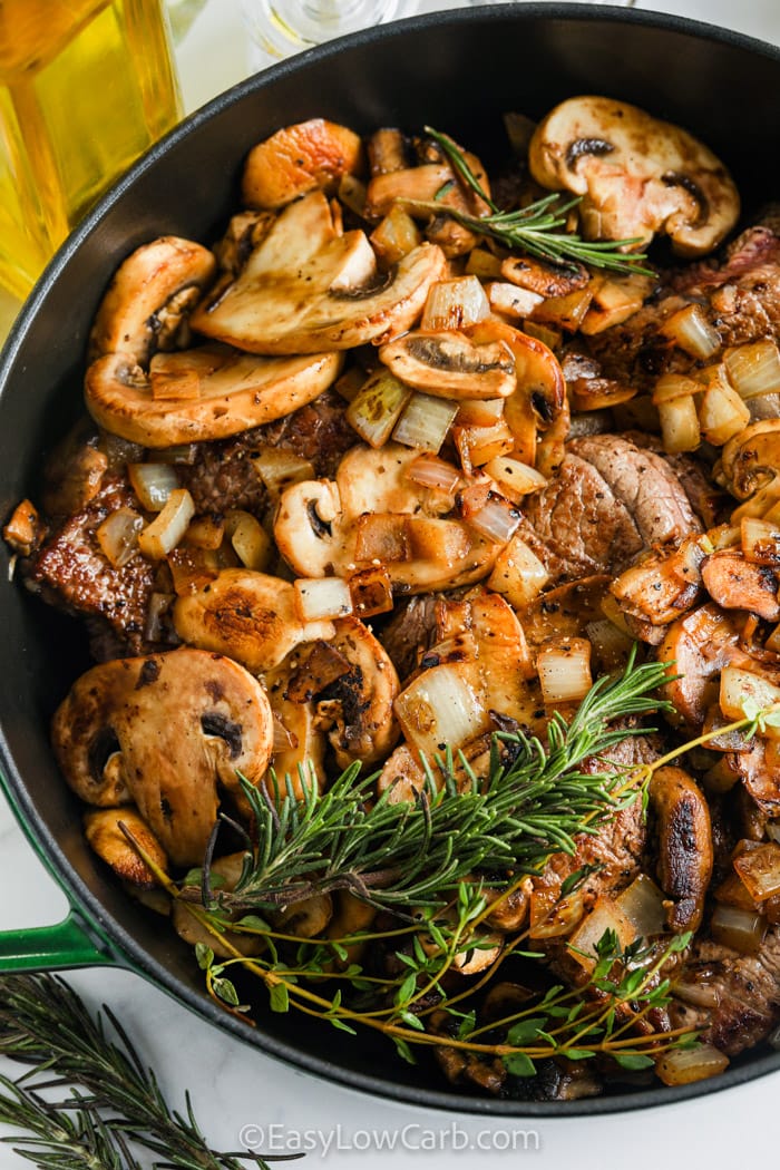 cooking Braised Steak and Mushrooms in a pan