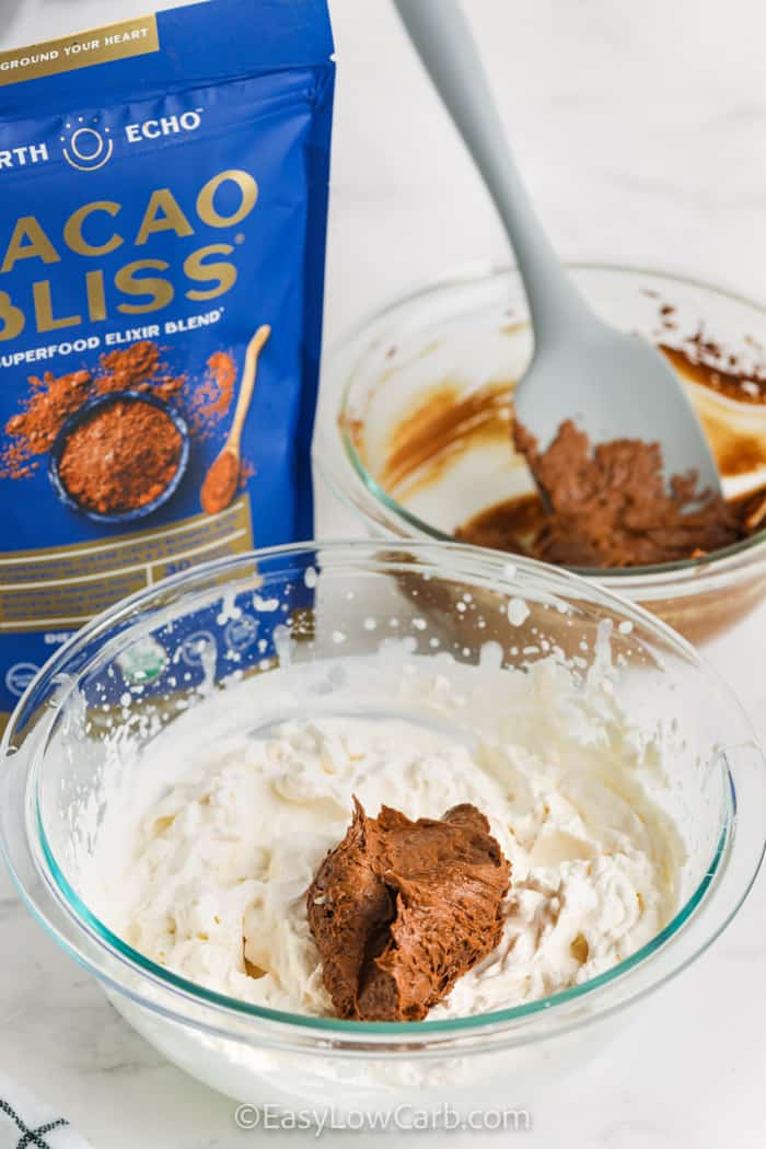 adding chocolate mix to whipped cream to make Chocolate Peanut Butter Mousse
