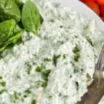 Creamy Spinach Dip in a bowl with text.