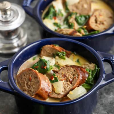 Creamy Sausage and Spinach Soup in two blue bowls