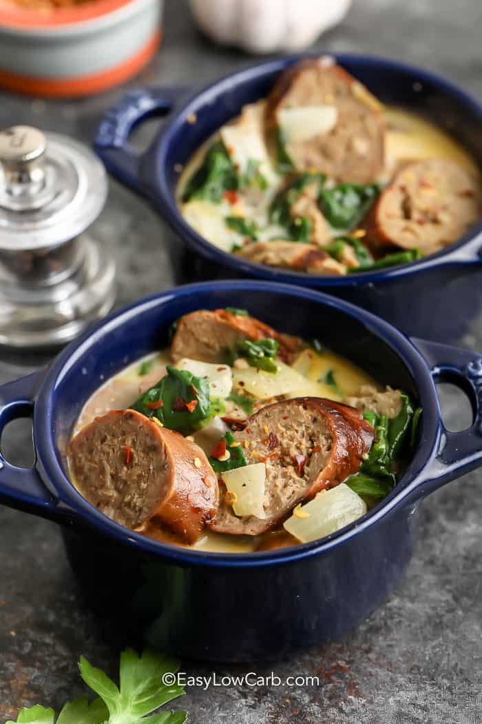 Creamy Sausage and Spinach Soup in two blue bowls