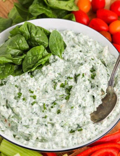 close up of Easy Spinach Dip in a bowl with a spoon