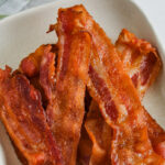 Air Fryer Bacon on a plate with writing