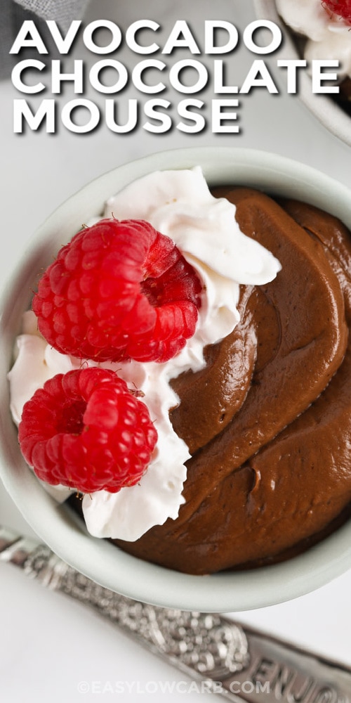 a serving of Avocado Chocolate Mousse with raspberries on top with text.