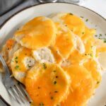 Keto Scalloped Potatoes on a plate with a fork