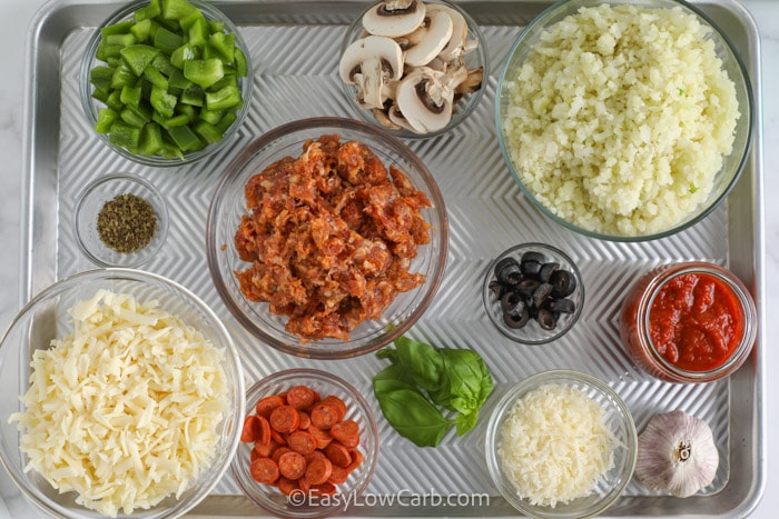 Pizza Bowl Ingredients assembled on a baking tray
