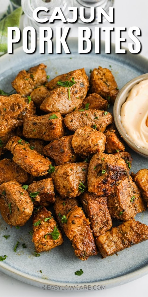 Cajun Pork Bites on a plate with writing