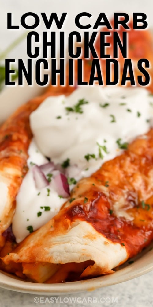 Low Carb Chicken Enchiladas on a plate with sour cream and red onions with writing
