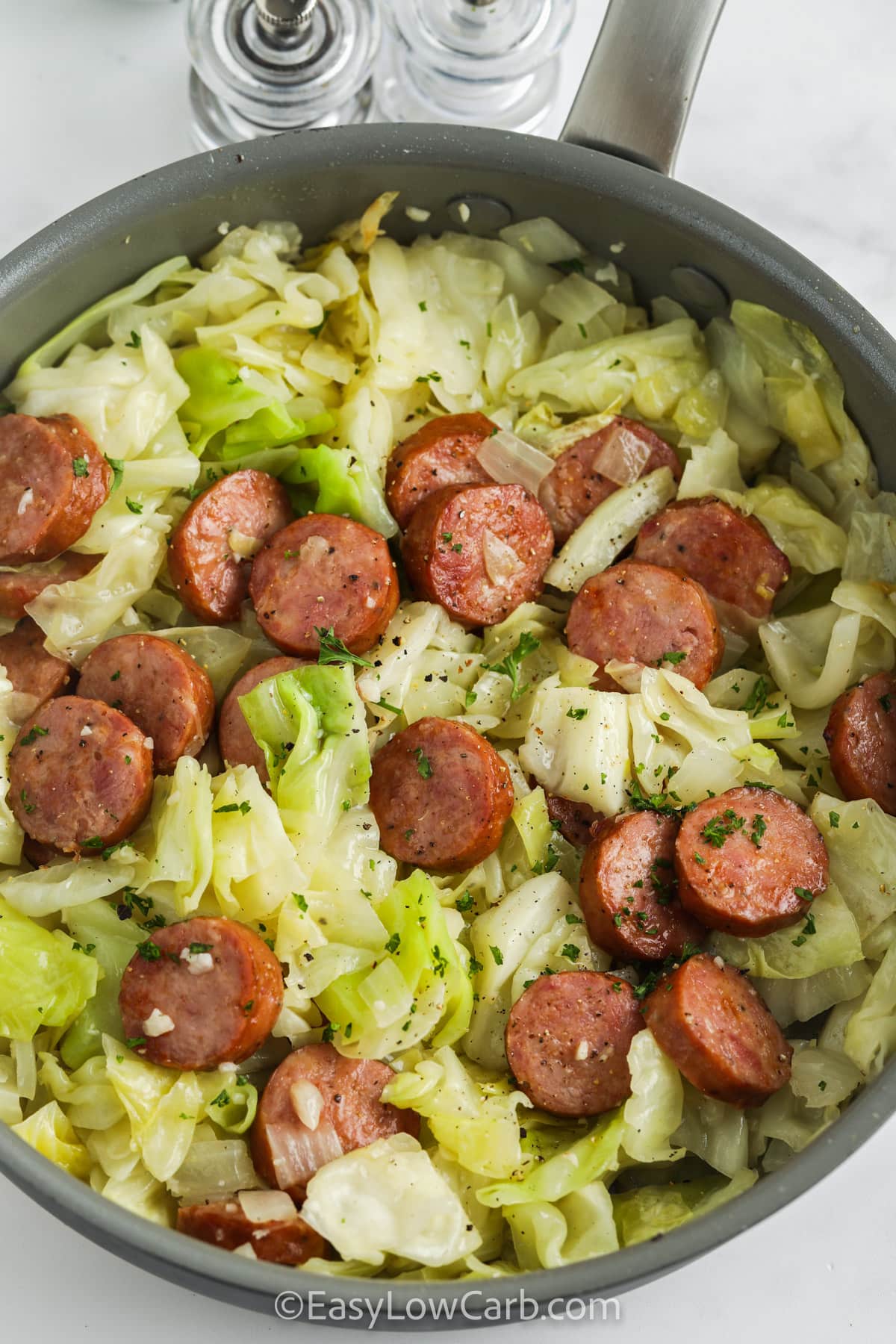 Fried Cabbage and Sausage in a skillet