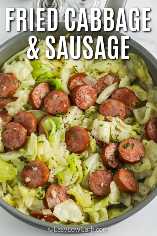 Fried Cabbage & Sausage in a skillet with writing
