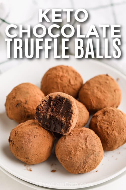 Keto Chocolate Truffle Balls with a bite taken out of one with writing