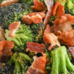 Broccoli & bacon on a plate with writing for Bacon Broccoli Air Fryer Recipe