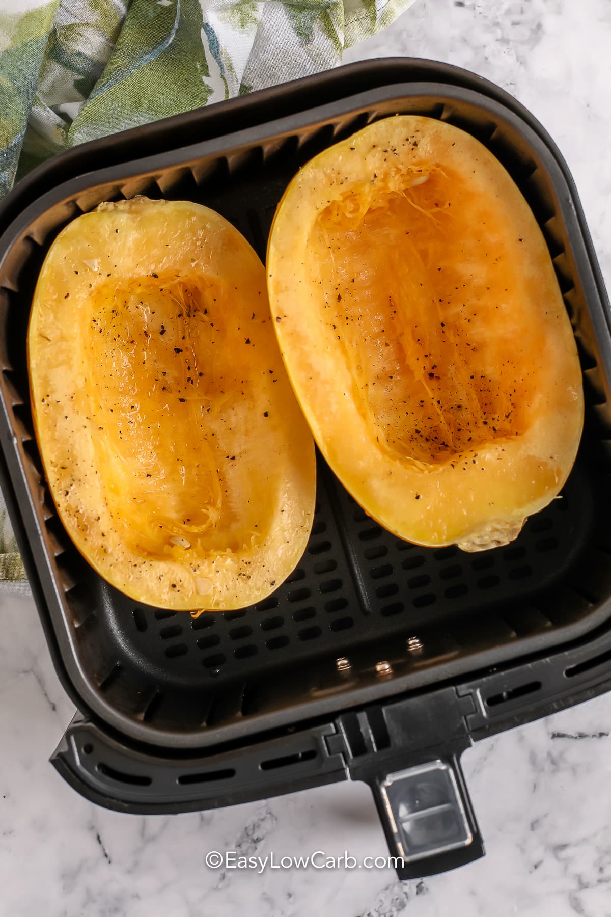 Air Fryer Spaghetti Squash in the air fryer before being baked