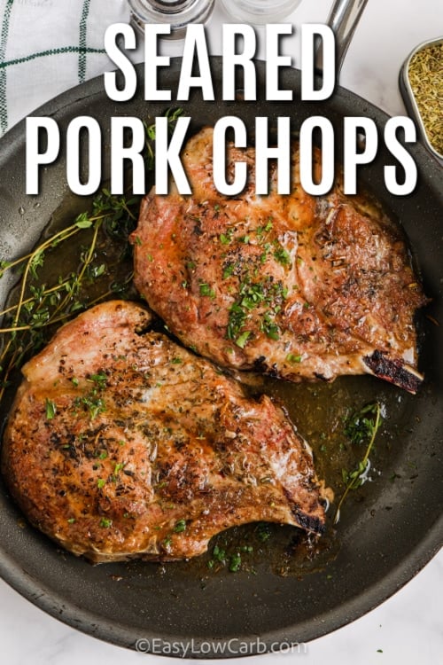 Pan Seared Pork Chops in a pan with writing