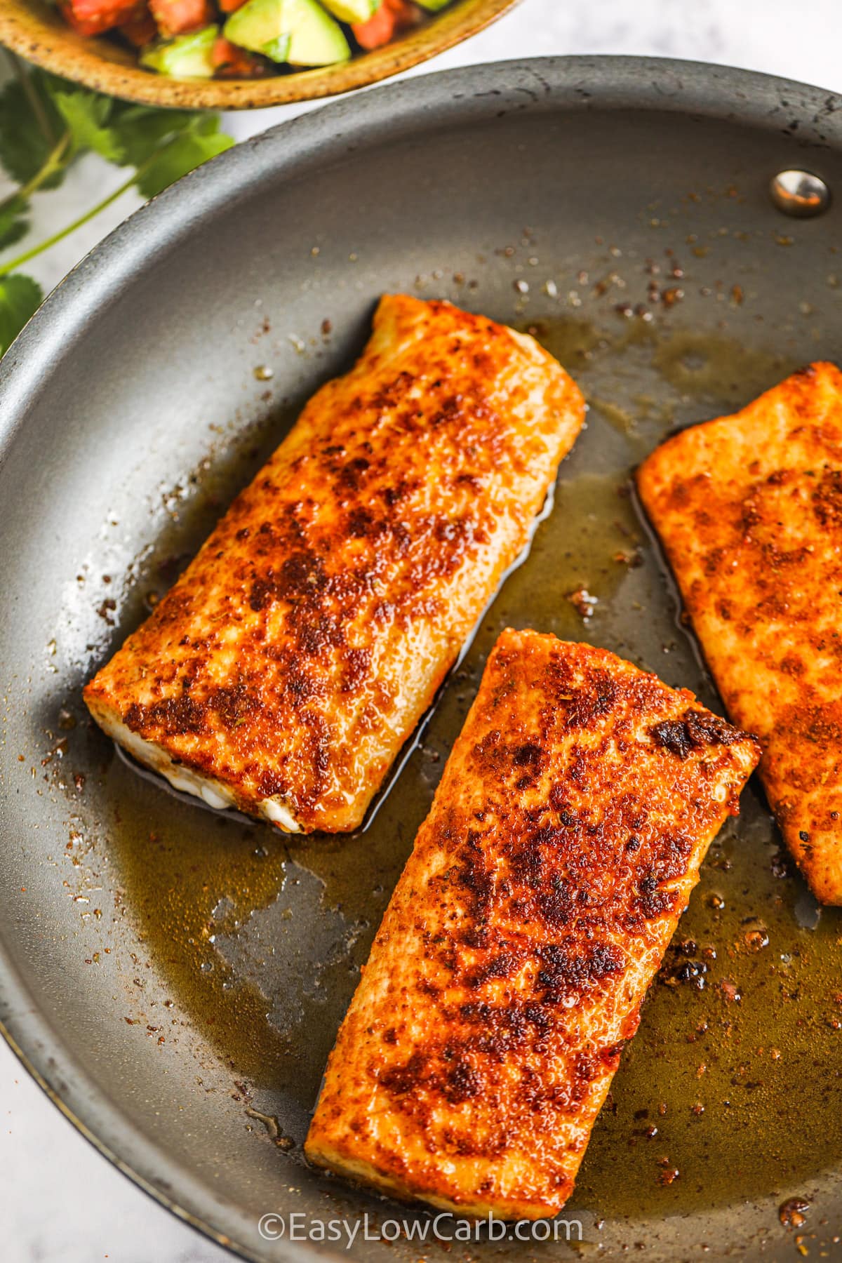 Blackened Mahi Mahi in a frying pan