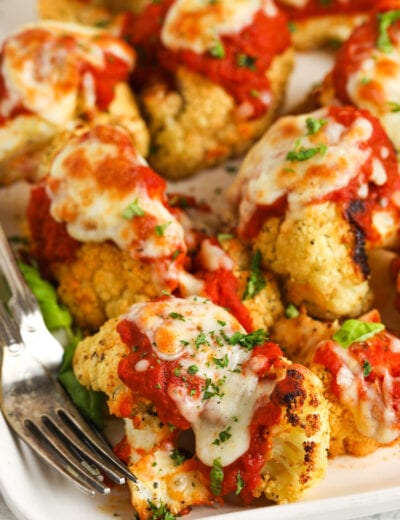 Cauliflower Parmesan on a plate with a fork