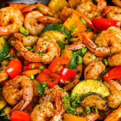 Easy Shrimp Vegetable Skillet in a frying pan with parsley and green onions as garnish