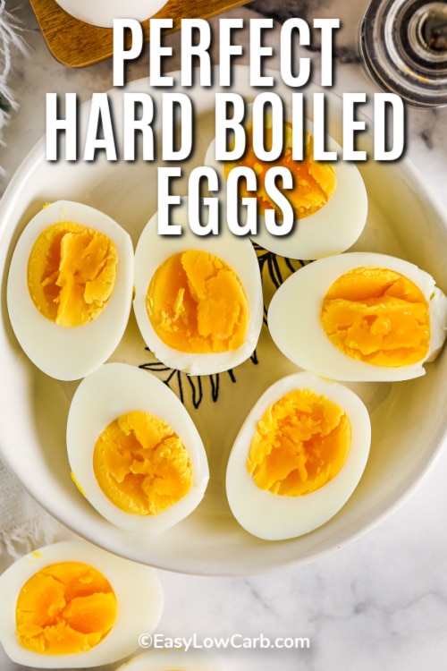 halved Hard Boiled Eggs in a bowl with writing
