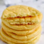 cloud bread in a stack with one ripped in half to show texture for Easy Cloud Bread Recipe