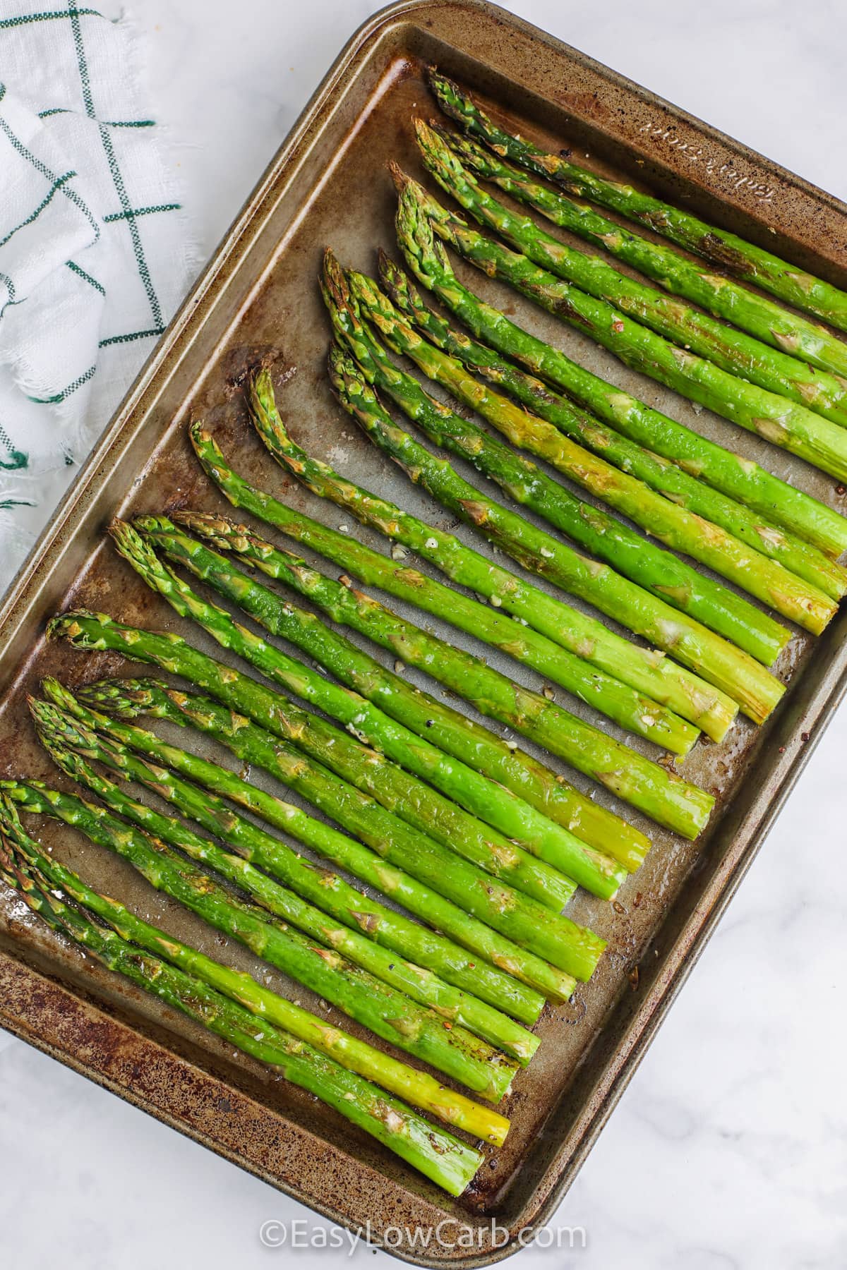asparagus on a baking sheet for Lemon Roasted Asparagus