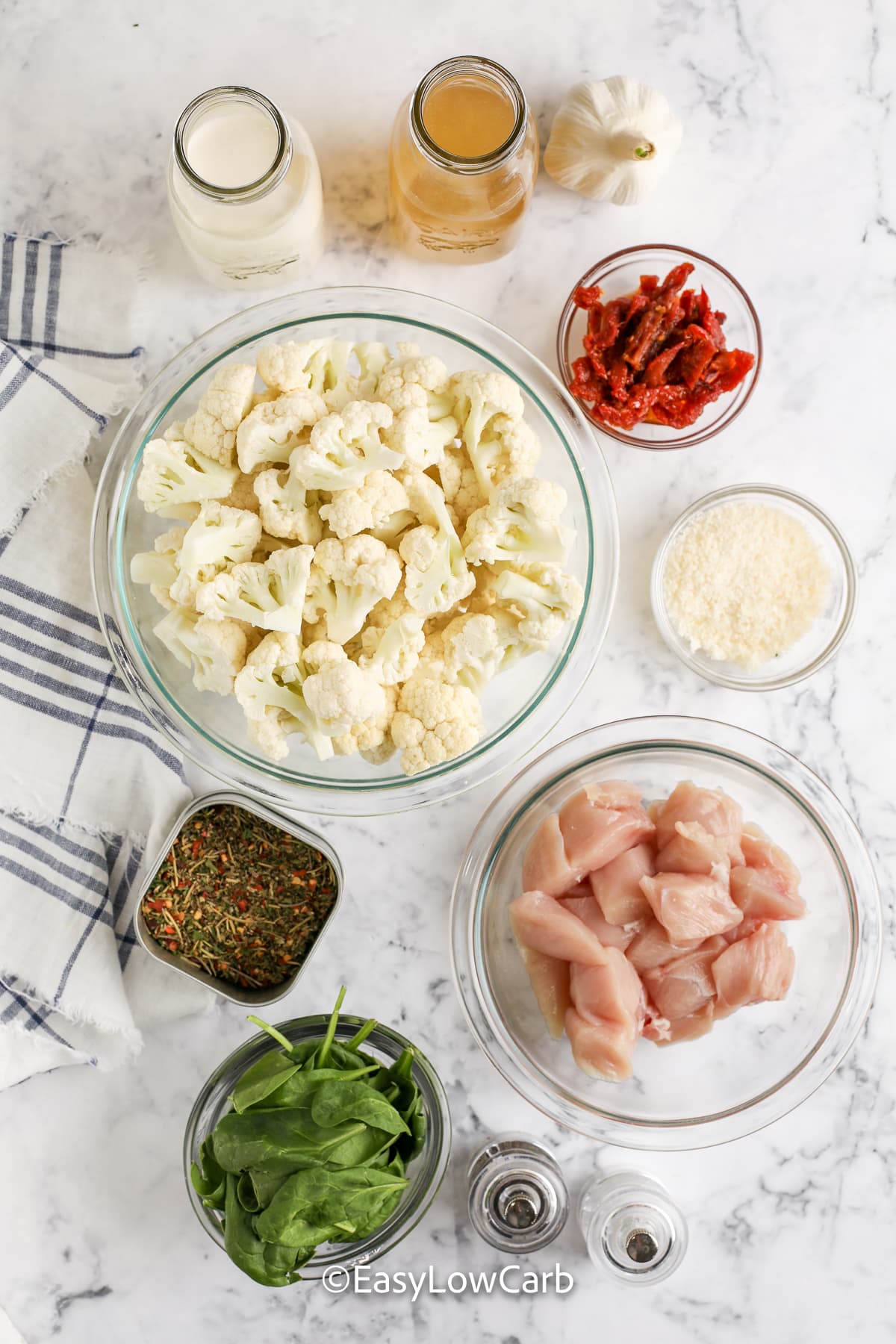 ingredients assembled for creamy tuscan chicken skillet