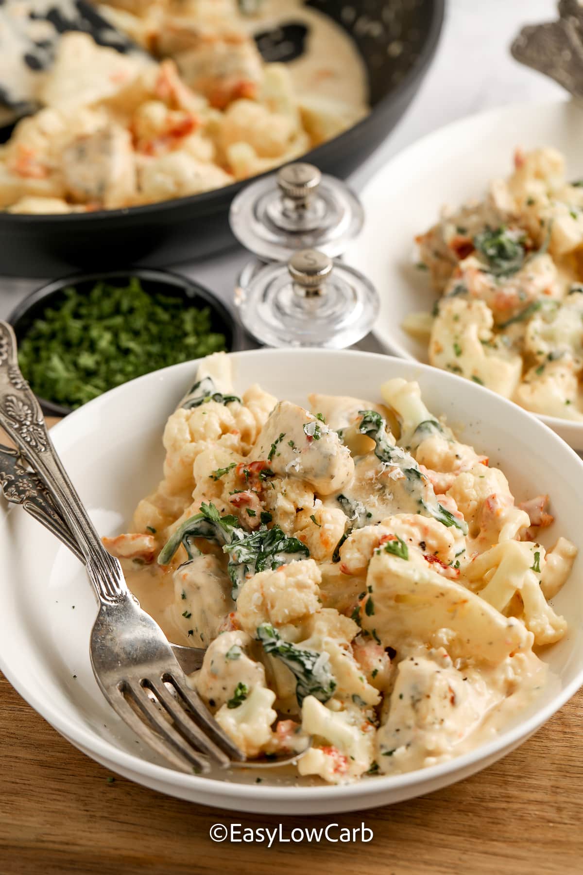 creamy tuscan chicken skillet on a bowl