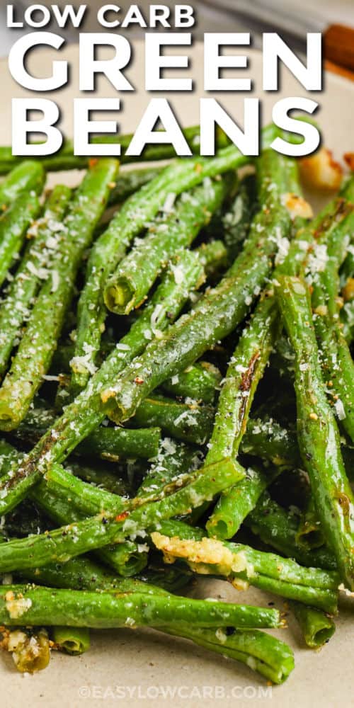 close up of Roasted Green Beans on a plate with writing