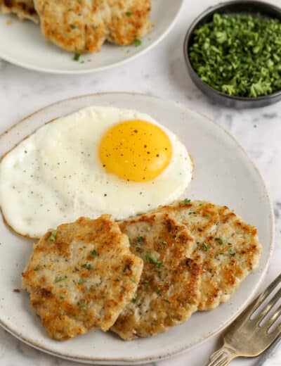 turkey breakfast sausage patties on a plate with eggs