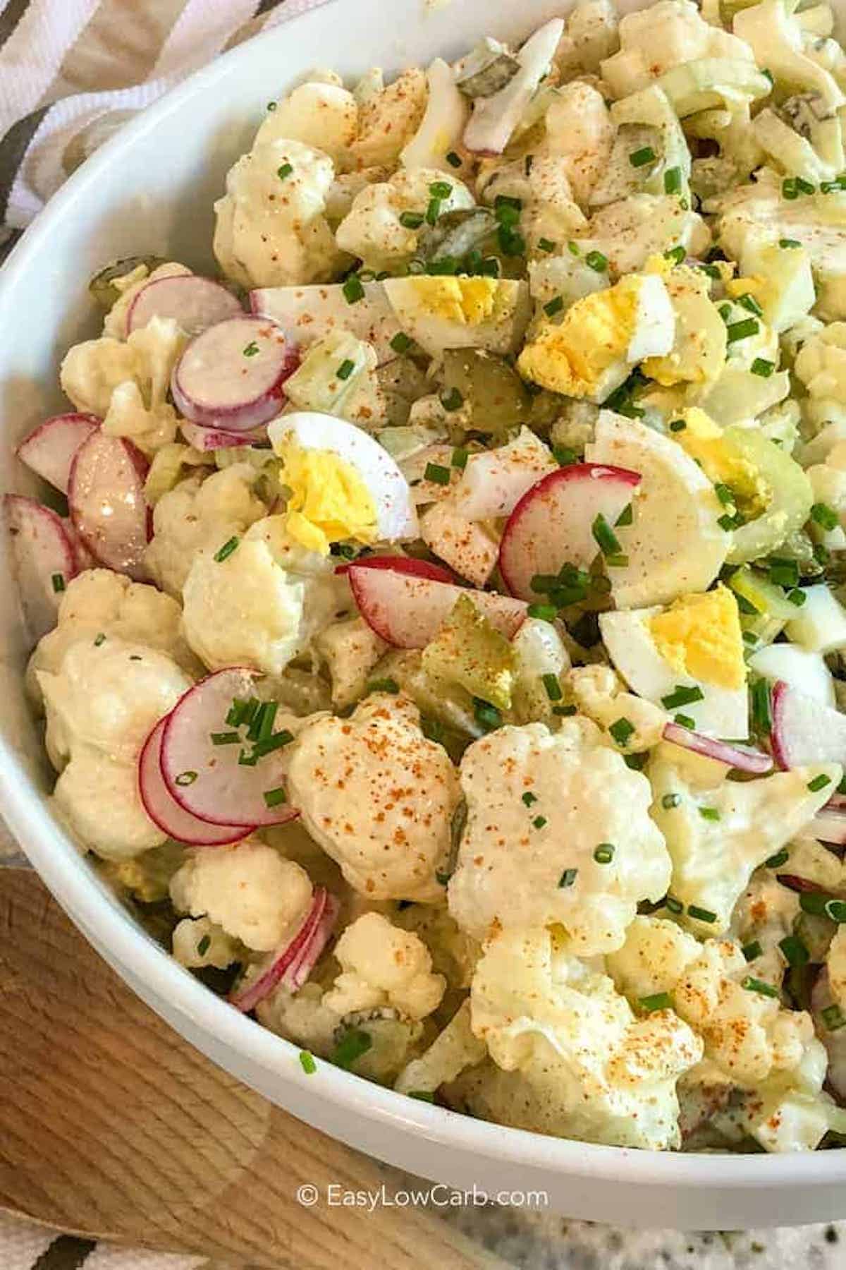 Cauliflower Potato Salad in a large white serving bowl