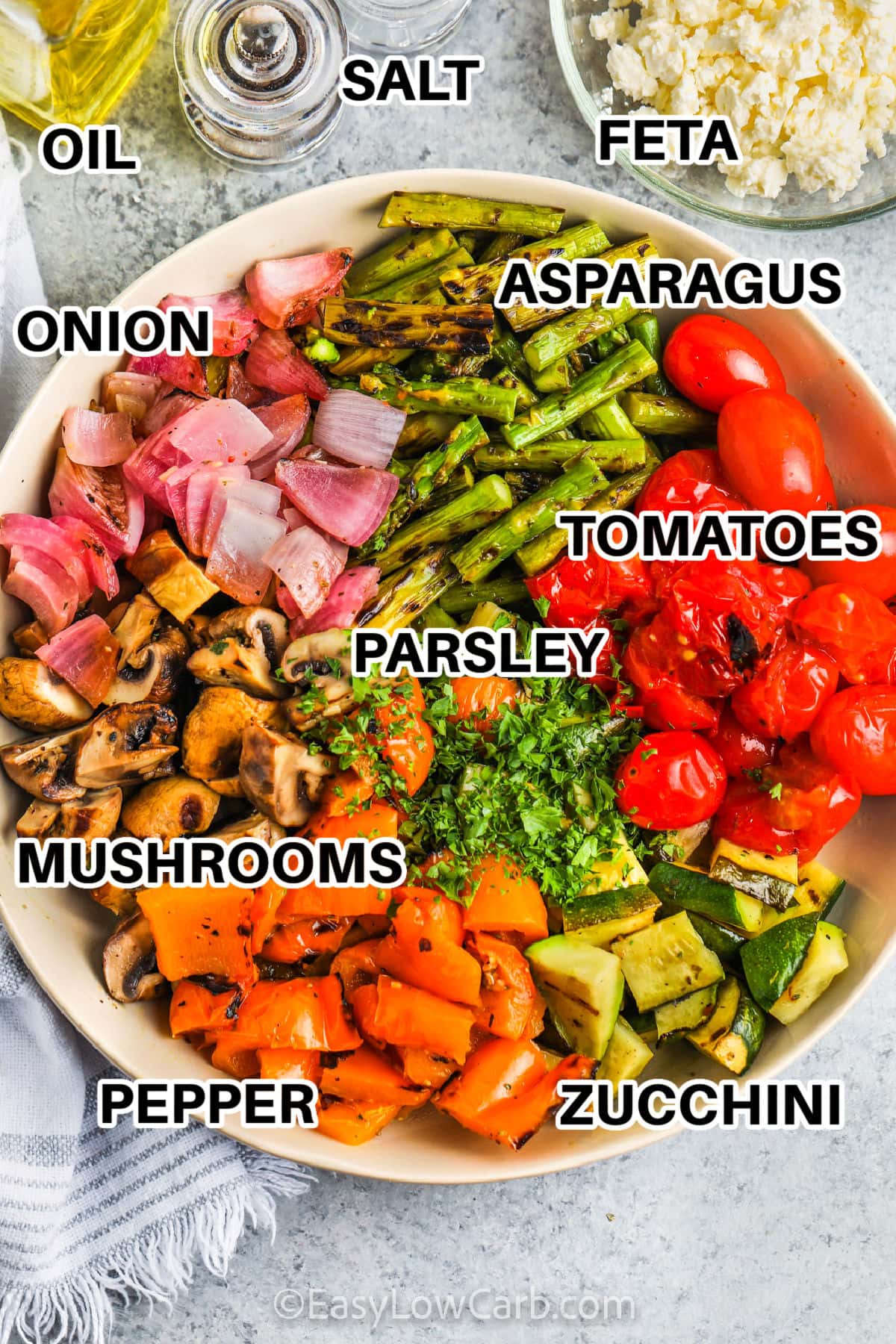 oil , salt , feta, parsley and vegetables in a bowl to make Grilled Vegetable Salad