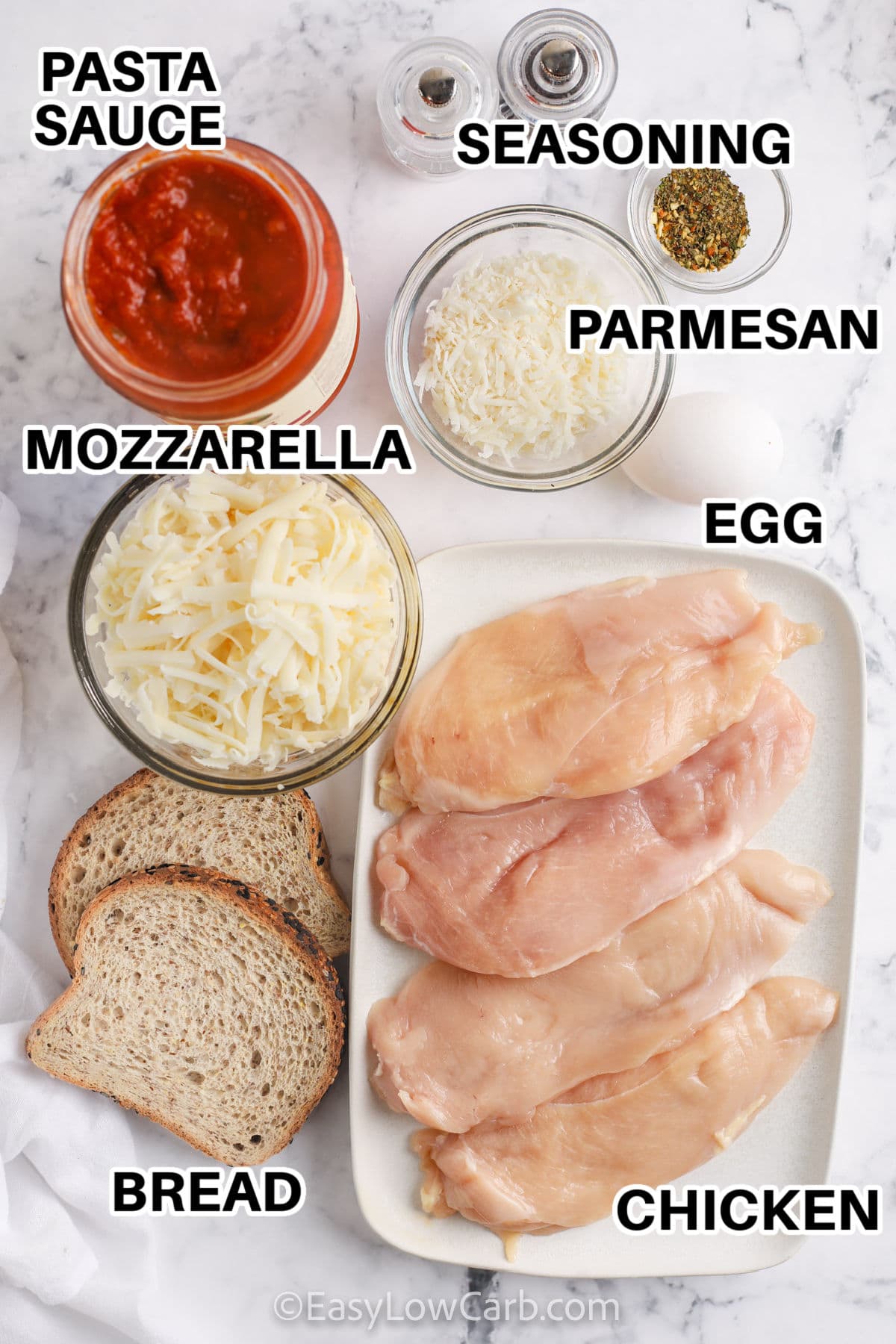 Chicken , mozzarella , parmesan , egg, seasoning , pasta sauce and bread to make Low Carb Baked Chicken Parmesan with labels