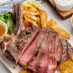 sliced ribeye steak on a plate