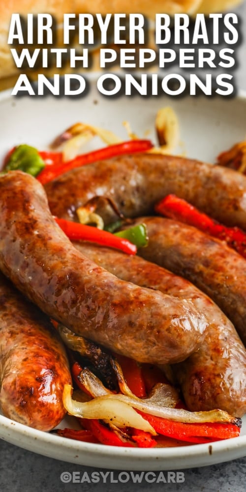 brats with peppers and onions on a plate with text